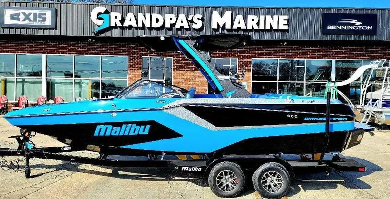 Slide: The Image of 2024 Malibu Wakesetter 23 MXZ boat at Grandpa's Marine dealership. - 12