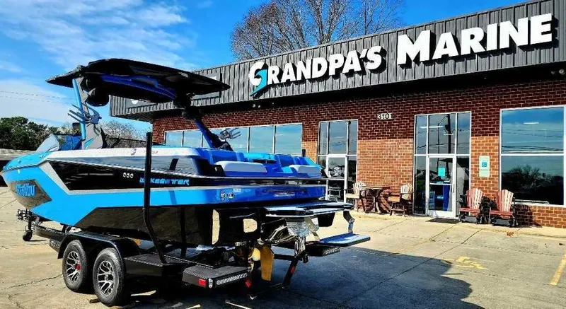 Slide: The Image of 2024 Malibu Wakesetter 23 MXZ boat at Grandpa's Marine dealership. - 4