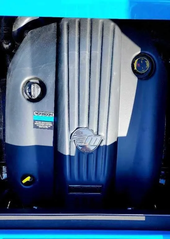 Slide: The Image of 2024 Malibu Wakesetter 23 MXZ engine, featuring Monsoon technology, in a sleek black casing. - 7