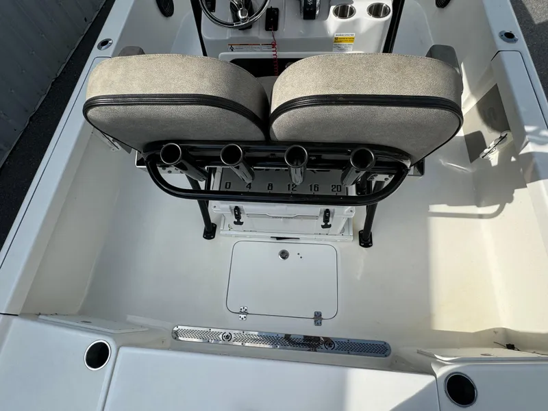 Slide: The Image of 2024 Sea Pro 248 boat interior with dual seats and rod holders. - 18