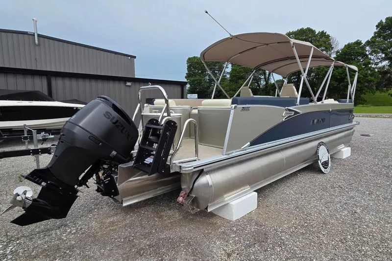 Slide: The Image of 2025 Avalon Platinum Catalina 2585 Quad Lounger pontoon boat with canopy and outboard motor. - 11