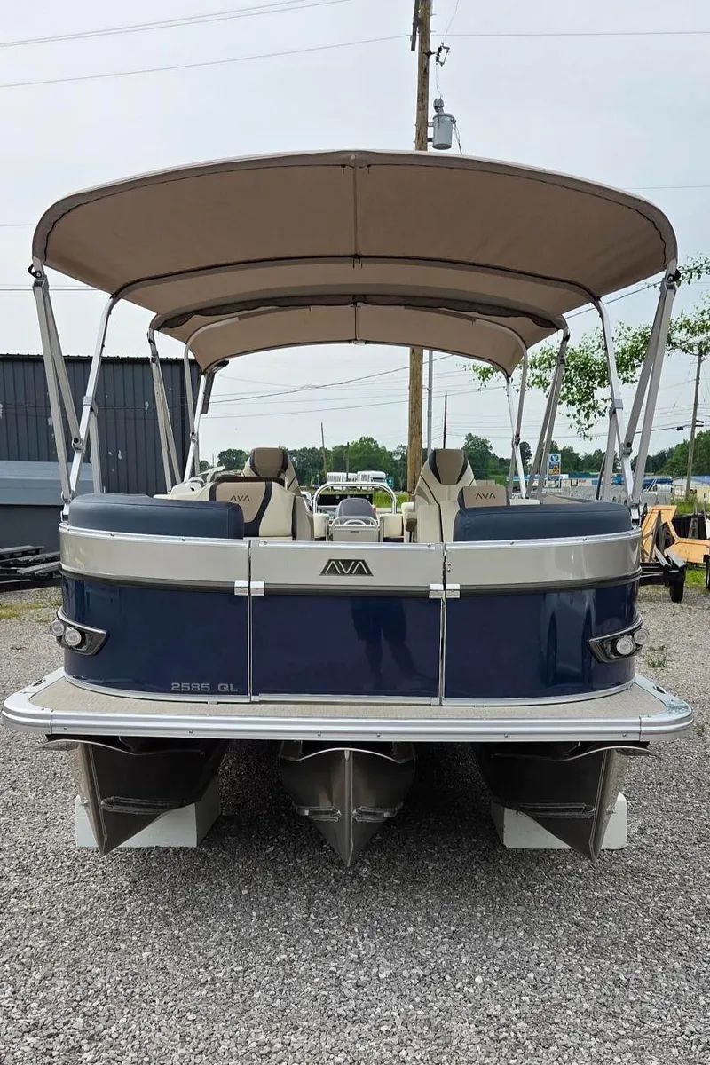 Slide: The Image of 2025 Avalon Platinum Catalina 2585 Quad Lounger pontoon boat, rear view, with canopy. - 2
