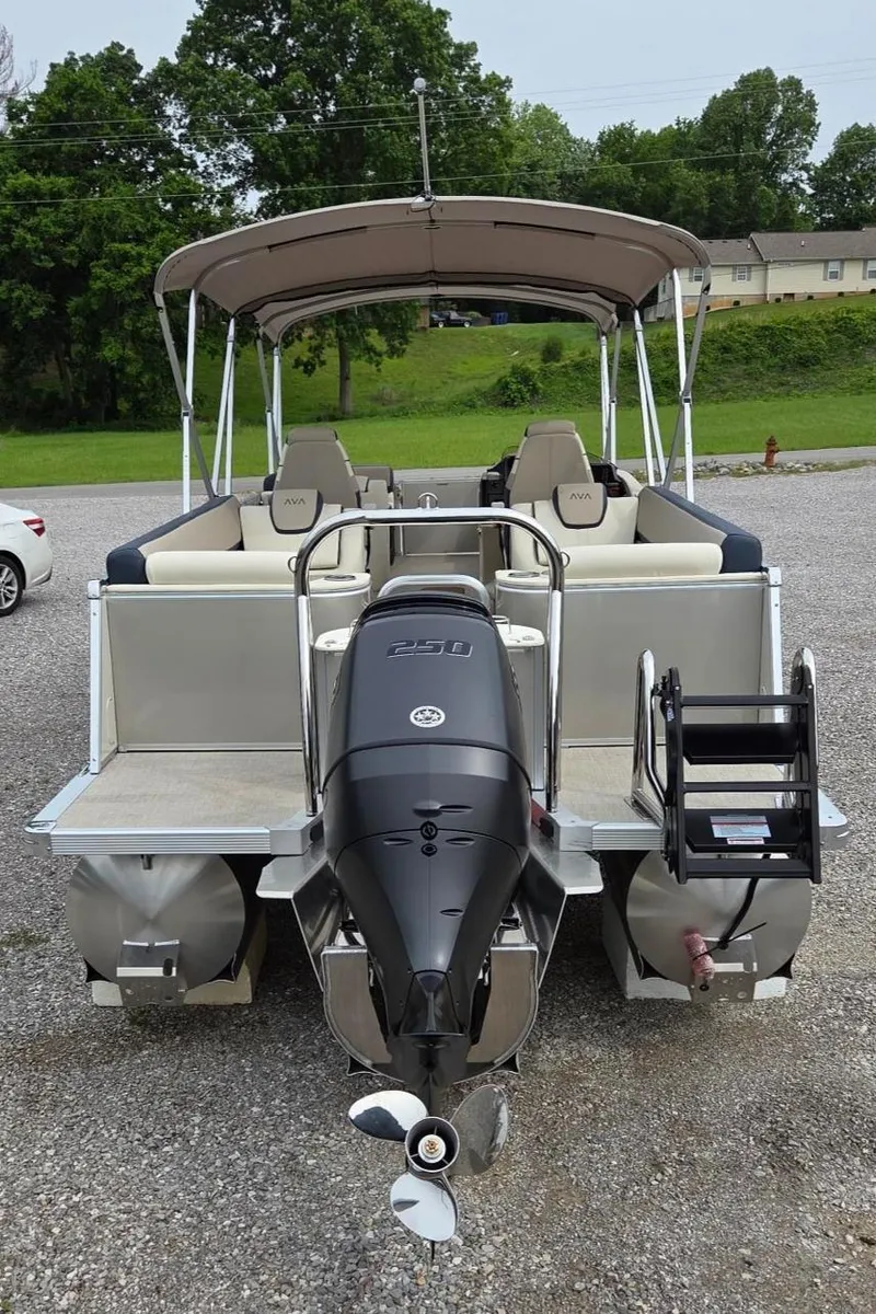 Slide: The Image of 2025 Avalon Platinum Catalina 2585 Quad Lounger pontoon boat, rear view with outboard motor. - 4
