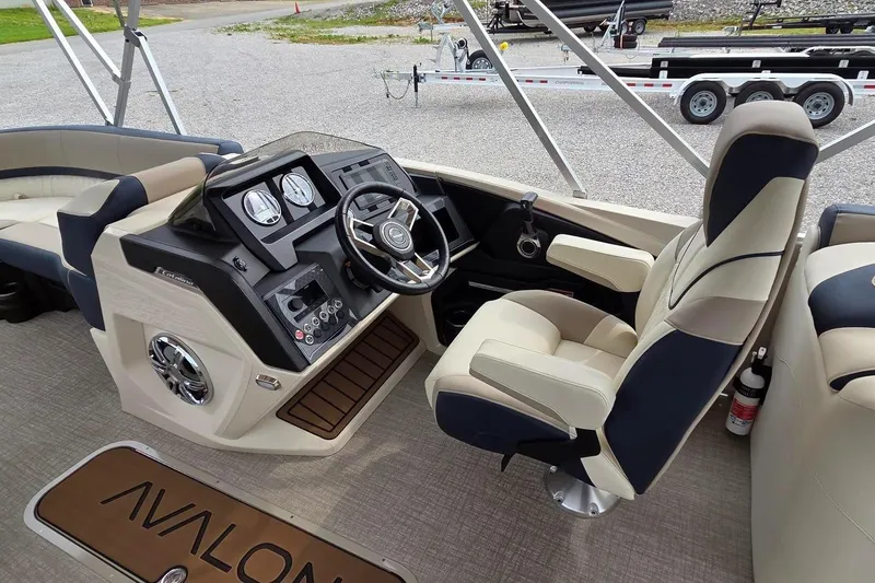 Slide: The Image of 2025 Avalon Platinum Catalina 2585 Quad Lounger interior with modern helm and comfortable seating. - 7