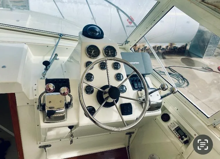 Slide: The Image of 1977 Bertram 28 Moppie helm with steering wheel and control panel. - 17