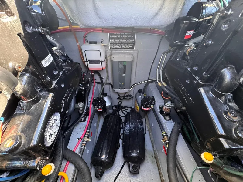 Slide: The Image of Engine compartment of a 1977 Bertram 28 Moppie boat, showcasing mechanical components. - 35