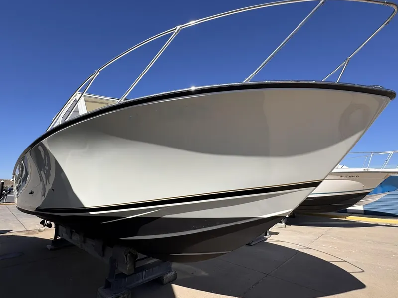 Slide: The Image of 1977 Bertram 28 Moppie boat on display, showcasing sleek design and sturdy build. - 5