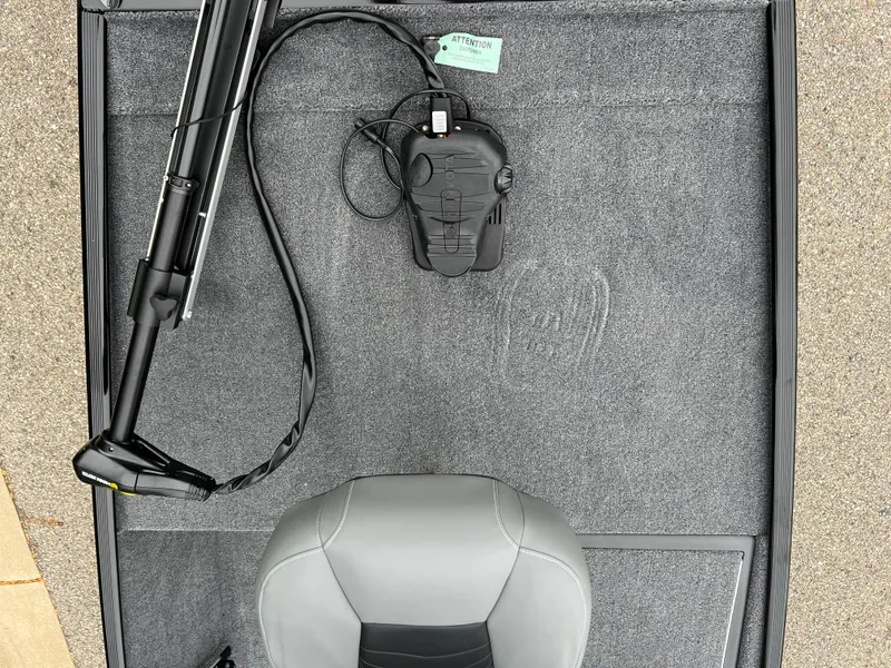 Slide: The Image of 2025 Tracker Bass Tracker Classic XL boat interior with seat and trolling motor. - 2