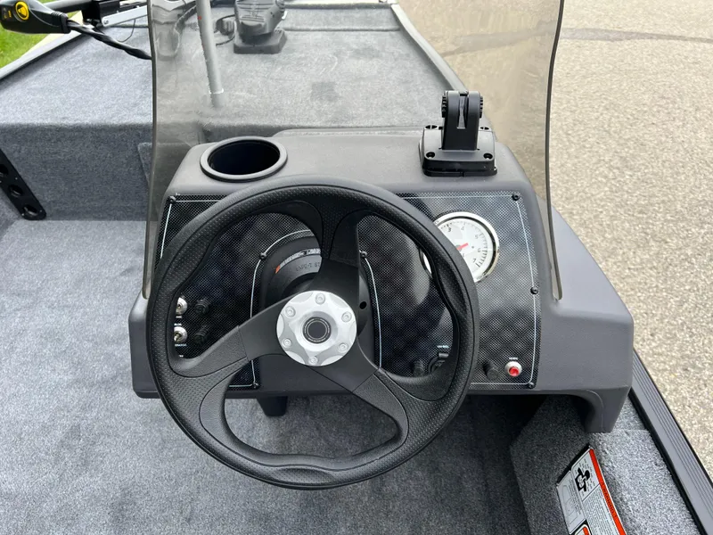 Slide: The Image of 2025 Tracker Bass Tracker Classic XL dashboard with steering wheel and gauge. - 3