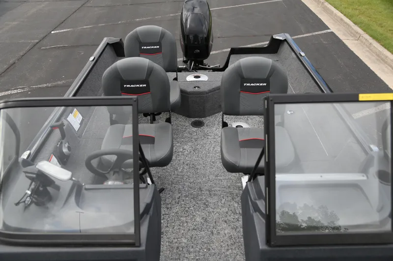 Slide: The Image of 2025 Tracker Pro Guide V-16 WT boat interior with seating and windshield. - 3
