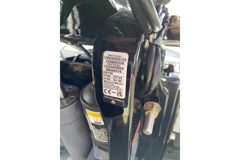 Slide: The Image of Label on Tracker Savage 215, 2025 model, displaying serial and model numbers. - 94