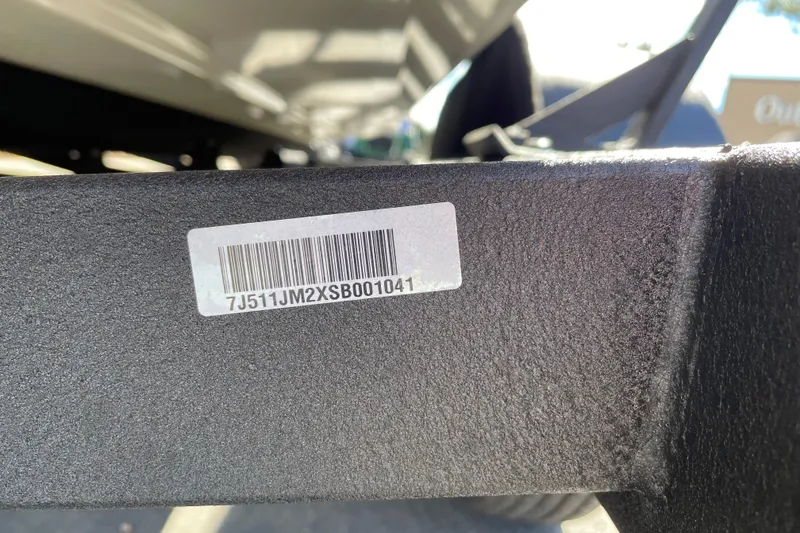 Slide: The Image of Barcode sticker on 2025 Tracker Savage 215 boat trailer frame. - 95