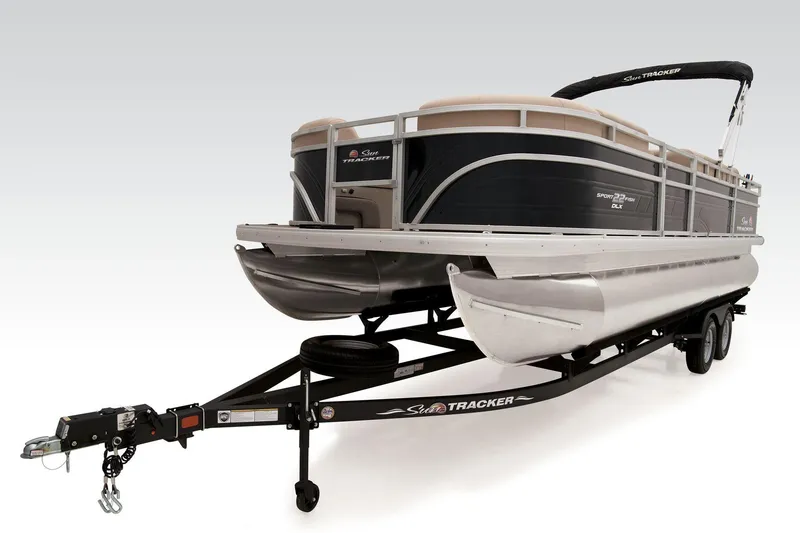 Slide: The Image of 2025 Sun Tracker SportFish 22 DLX boat dashboard with steering wheel and controls. - 19