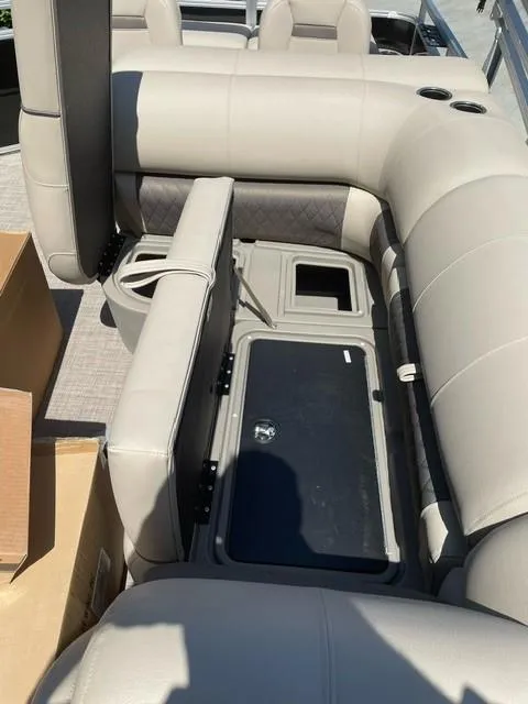 Slide: The Image of 2025 Sun Tracker SportFish 22 DLX pontoon boat with spacious seating and modern design. - 6