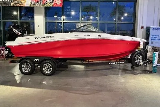 The Image of 2025 Tahoe 200 S boat with red hull on display indoors. - 0