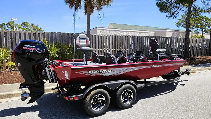 Slide: The Image of 2025 Ranger RT188P boat with Mercury Pro XS engine, parked outdoors. - 1