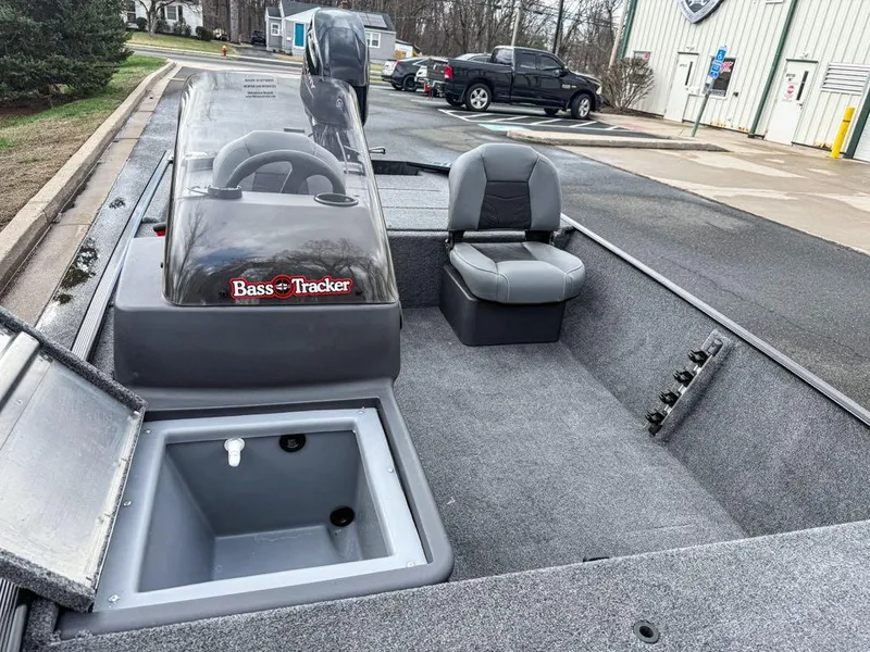 Slide: The Image of 2025 Tracker Bass Tracker Classic XL boat interior with seating and storage compartments. - 2