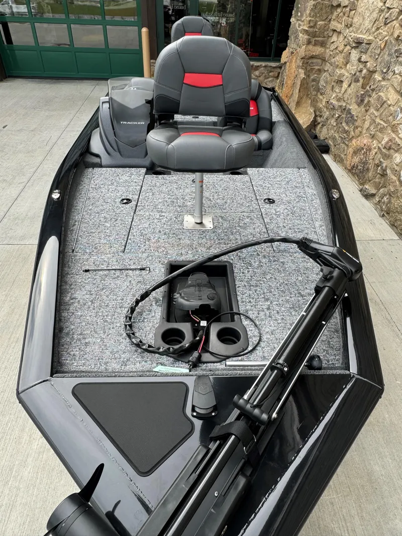Slide: The Image of 2025 Tracker Pro Team 175 boat with modern seating and fishing equipment. - 2