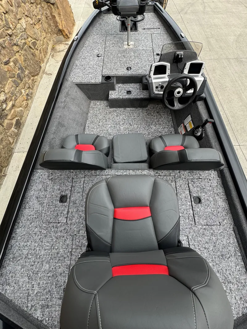 Slide: The Image of 2025 Tracker Pro Team 175 boat interior with modern seating and control panel. - 4