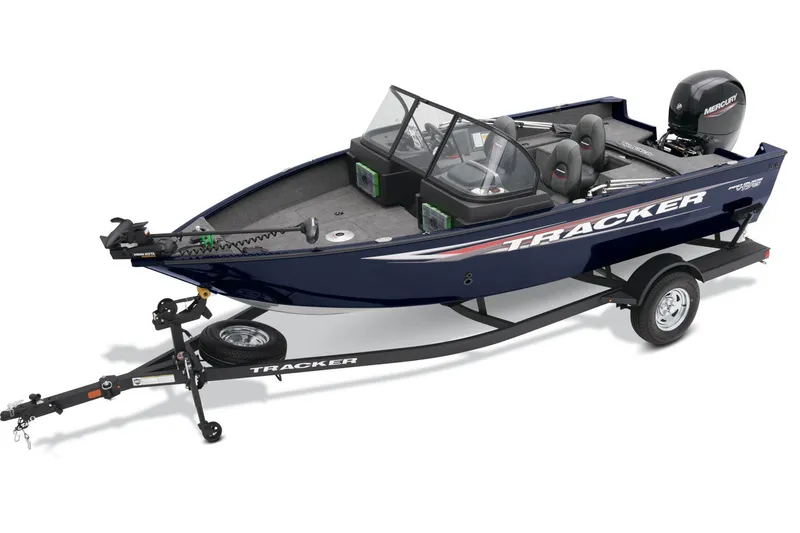 Slide: The Image of 2025 Tracker Pro Guide V-175 Combo boat with Mercury engine in showroom. - 2