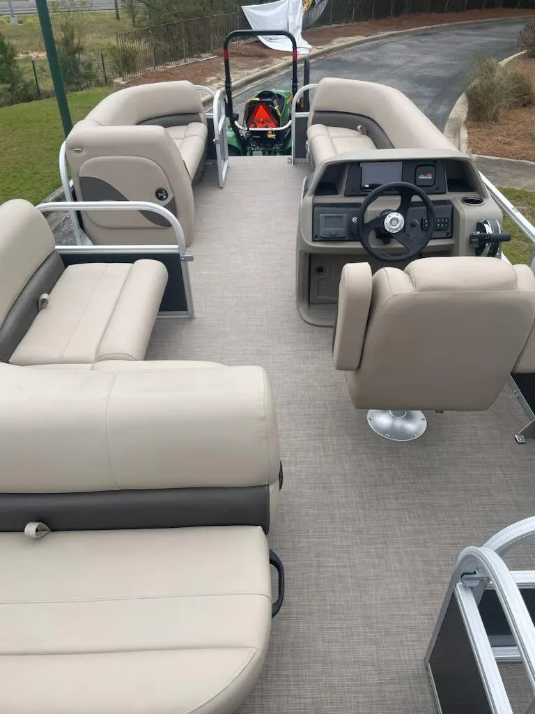 Slide: The Image of 2025 Sun Tracker Party Barge 18 DLX with spacious seating and modern helm. - 2