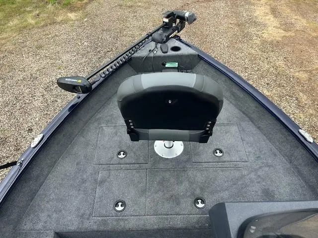 Slide: The Image of 2025 Tracker Pro Guide V-16 SC boat interior with seat and trolling motor. - 10