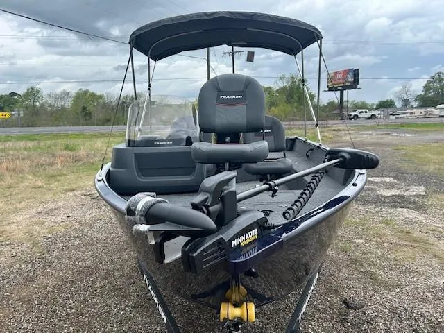 Slide: The Image of 2025 Tracker Pro Guide V-16 SC boat with canopy and Minn Kota trolling motor. - 4