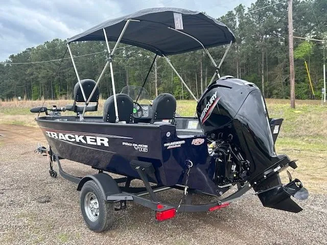 Slide: The Image of 2025 Tracker Pro Guide V-16 SC boat with Mercury engine on a trailer. - 7