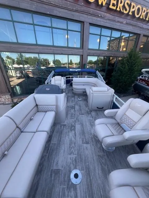 Slide: The Image of 2025 Ranger Reata 220FC pontoon boat with luxurious seating and modern design. - 3
