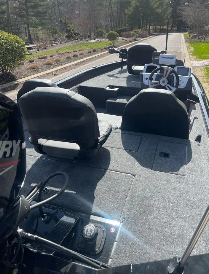 Slide: The Image of 2025 Tracker Pro Team 175 boat interior with seating and steering console. - 4