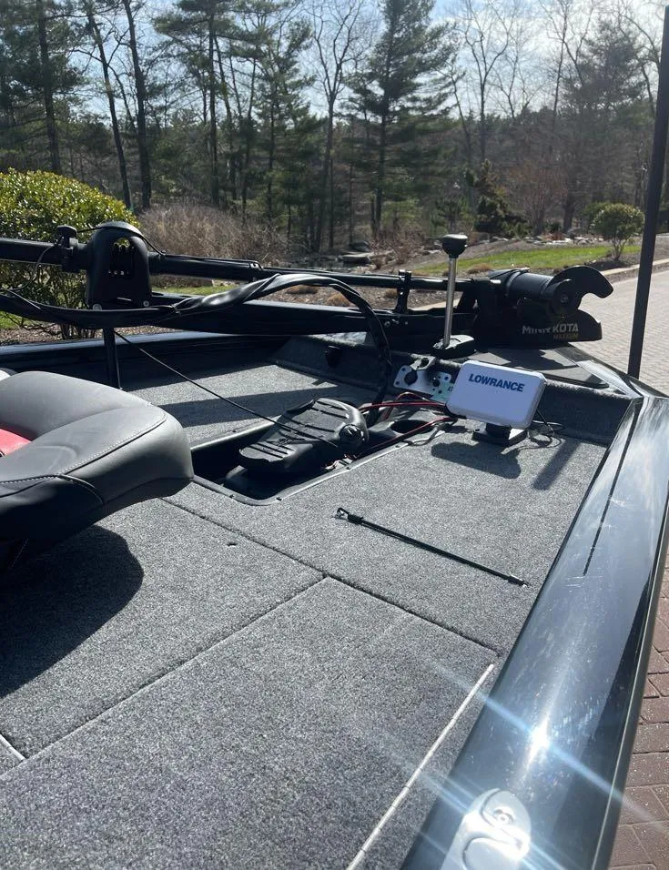 Slide: The Image of 2025 Tracker Pro Team 175 boat deck with fishing equipment and Lowrance electronics. - 5