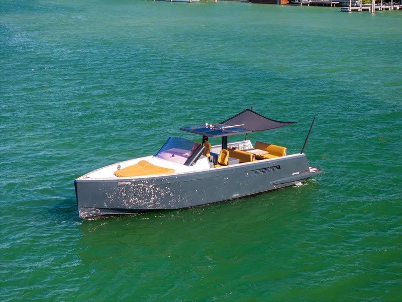 Slide: The Image of 2011 Fjord 40 Open yacht cruising on clear turquoise water. - 0