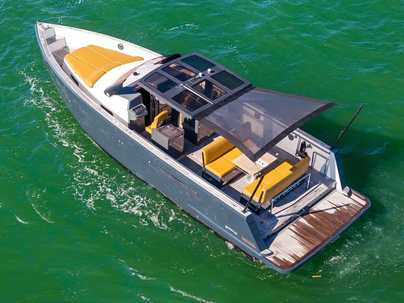 Slide: The Image of Fjord 40 Open 2011 yacht with sunshade, cruising on clear green water. - 18