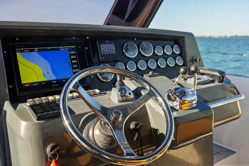Slide: The Image of Helm of 2011 Fjord 40 Open yacht with navigation instruments and steering wheel. - 3