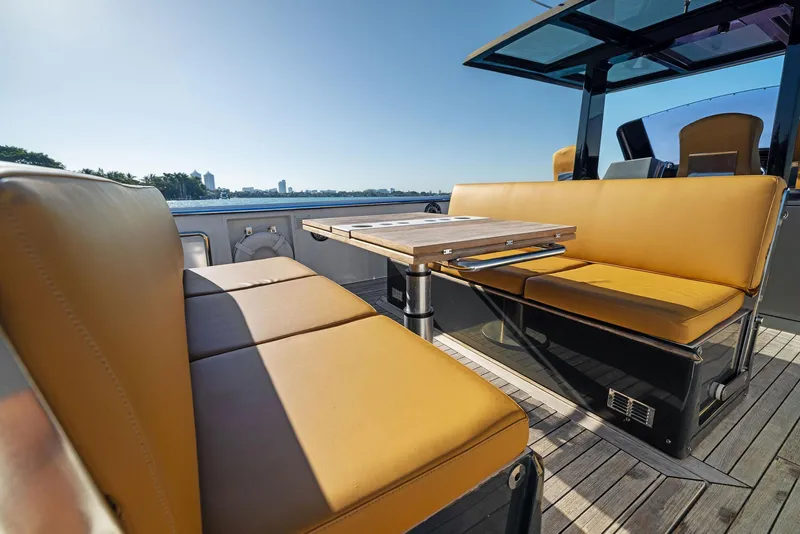 Slide: The Image of Luxurious seating area on a 2011 Fjord 40 Open yacht with tan leather upholstery. - 33