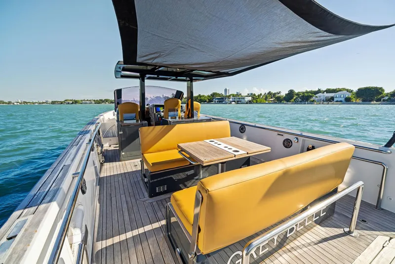 Slide: The Image of Luxurious 2011 Fjord 40 Open yacht with spacious seating and canopy on a sunny day. - 36