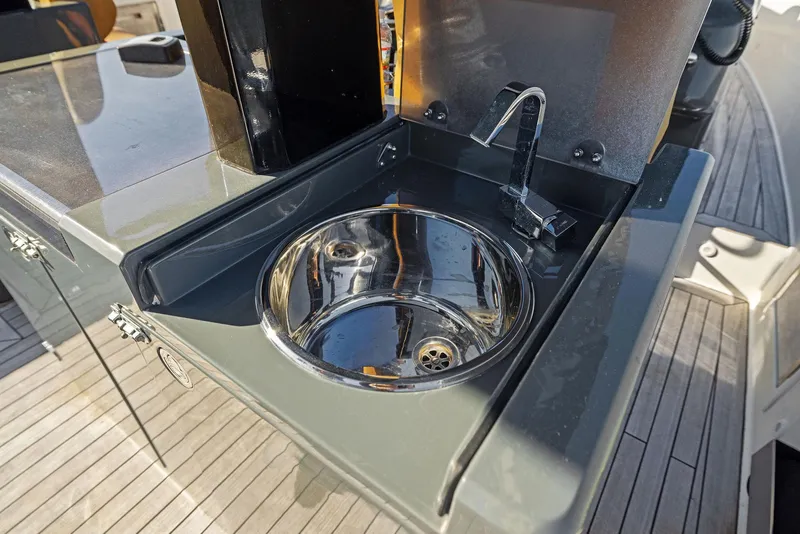 Slide: The Image of Stainless steel sink on 2011 Fjord 40 Open yacht deck, featuring modern design and faucet. - 38