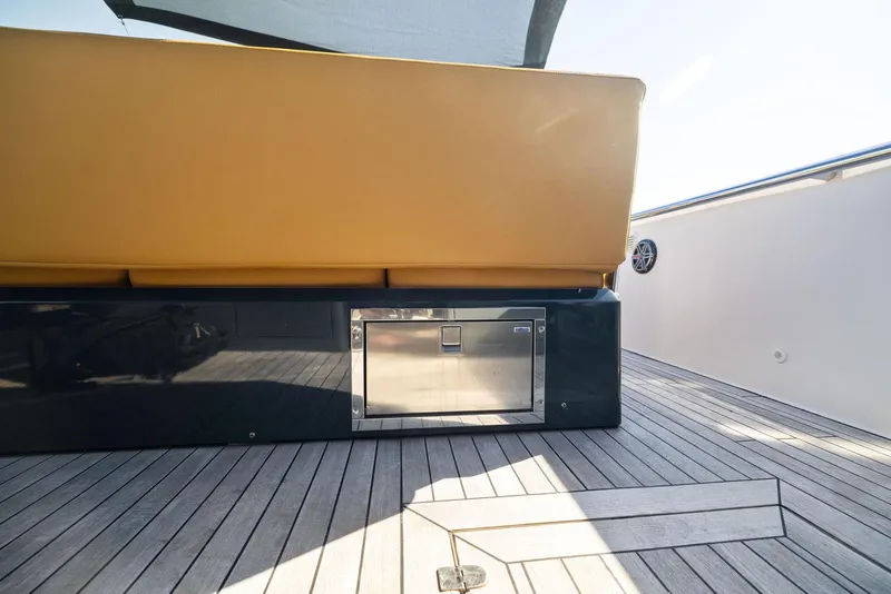 Slide: The Image of Fjord 40 Open 2011 yacht deck with cushioned seating and built-in storage. - 39