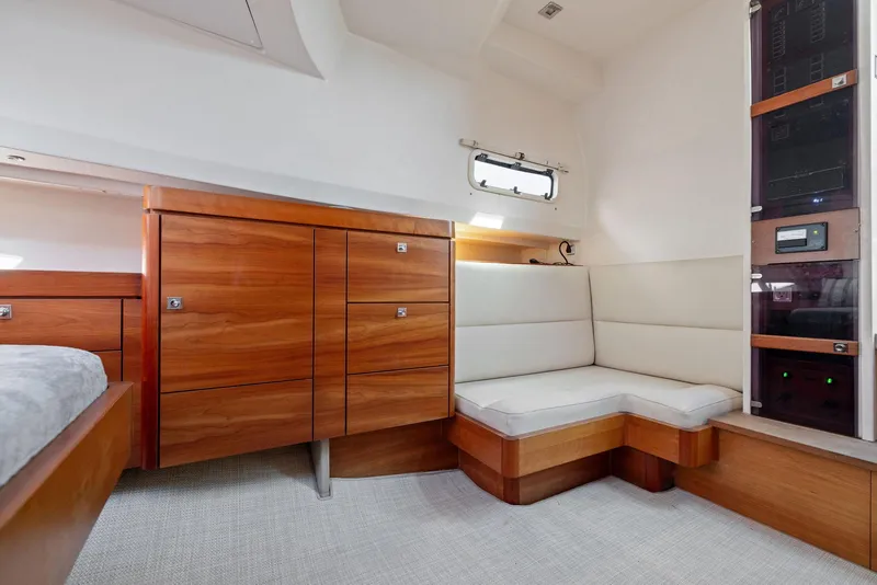 Slide: The Image of Luxurious interior of 2011 Fjord 40 Open yacht with wooden cabinetry and cushioned seating. - 40