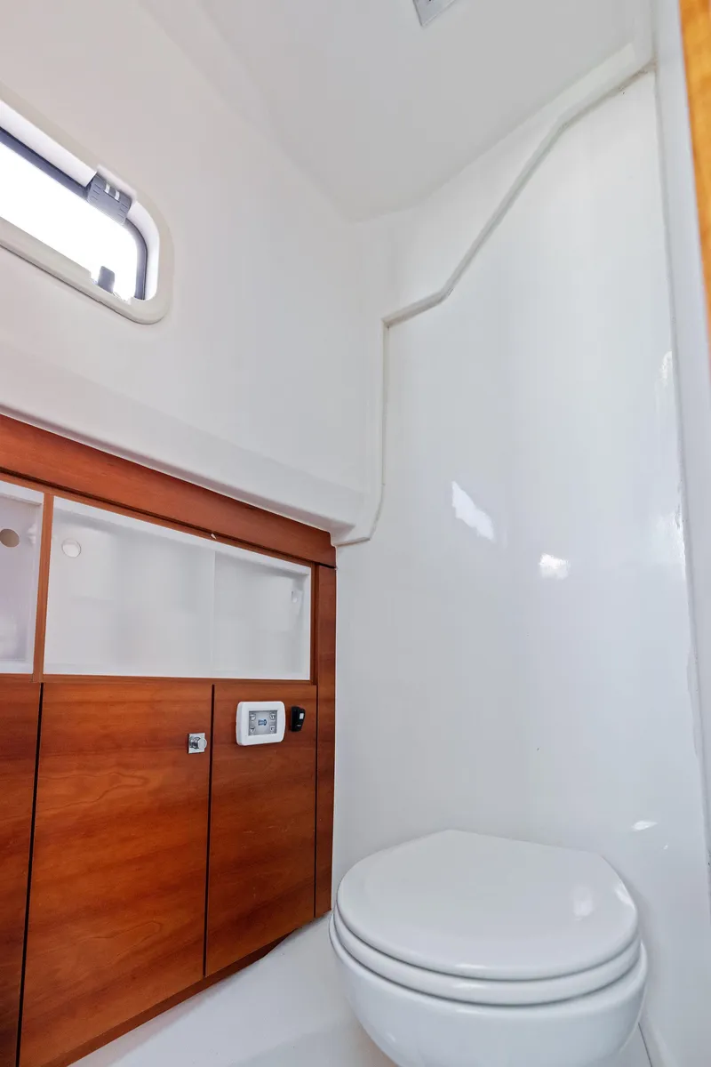Slide: The Image of 2011 Fjord 40 Open yacht bathroom with wooden cabinetry and modern fixtures. - 46