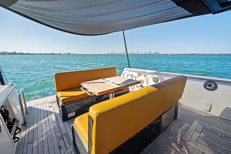 Slide: The Image of Luxury seating area on 2011 Fjord 40 Open yacht with ocean view. - 7