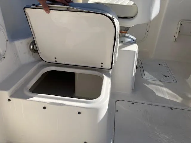 Slide: The Image of Open storage compartment on 2005 Sea Hunt Victory 225 boat. - 12