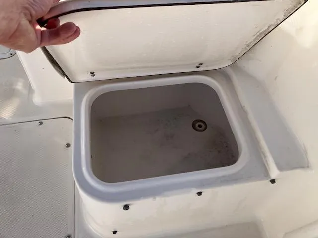 Slide: The Image of Open storage compartment on 2005 Sea Hunt Victory 225 boat. - 13