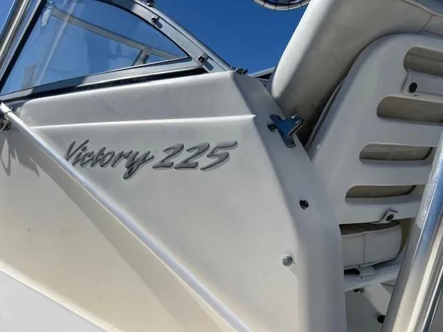 Slide: The Image of 2005 Sea Hunt Victory 225 boat, close-up of model name on white exterior. - 2