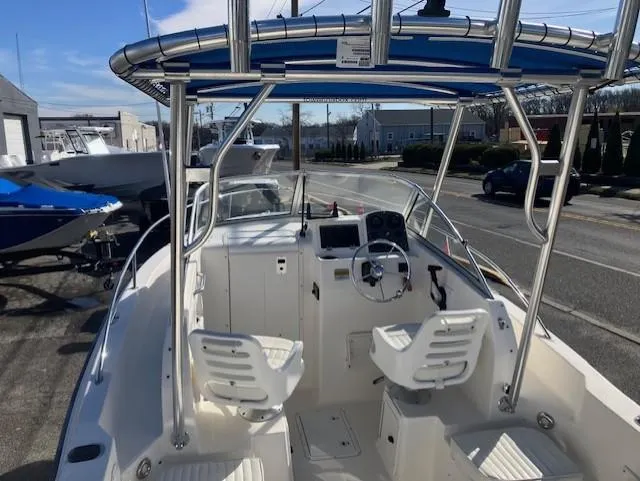 Slide: The Image of 2005 Sea Hunt Victory 225 boat interior with dual seats and steering console. - 4