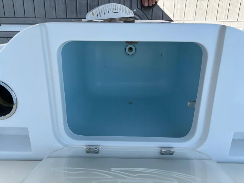 Slide: The Image of Open storage compartment on 2023 Glasstream 280 Pro-XS boat. - 14