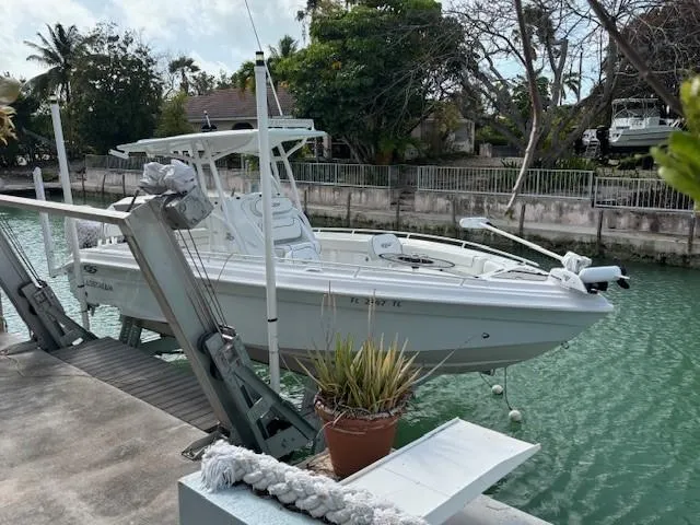 Slide: The Image of 2023 Glasstream 280 Pro-XS boat docked on a lift by a canal. - 15