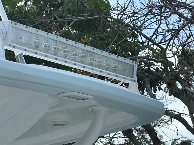 Slide: The Image of 2023 Glasstream 280 Pro-XS boat with LED light bar, trees in background. - 16