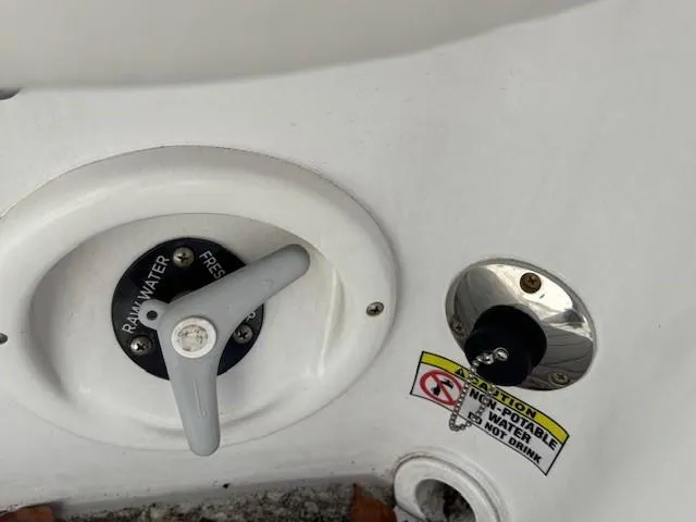 Slide: The Image of 2023 Glasstream 280 Pro-XS boat water control panel with caution label. - 17