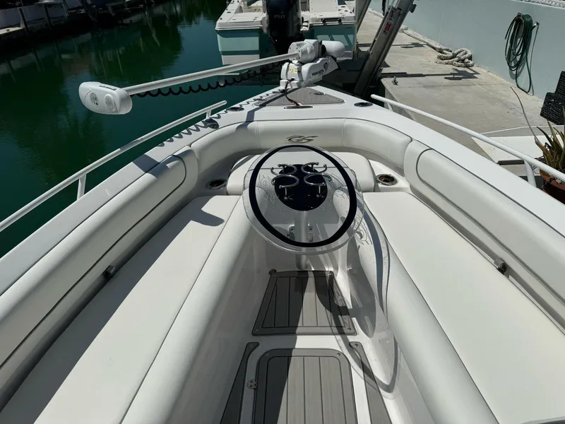 Slide: The Image of 2023 Glasstream 280 Pro-XS boat interior with steering wheel and control panel. - 2